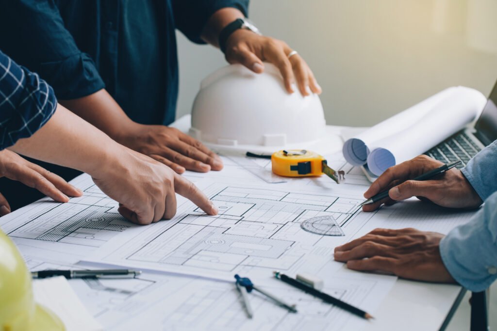 Jasa Desain Arsitektur Engineer or architect meeting for project working with partner a